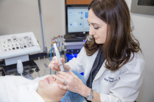 dermatologist performing a chemical peel on a patient from San Diego