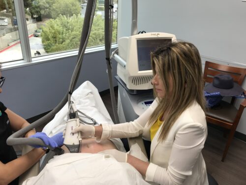 dermatologist performing a burn treatment