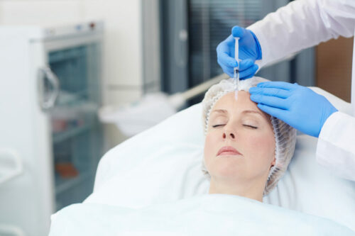 stock image of a woman receiving an injectable treatment