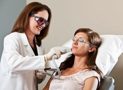 cosmetic laser dermatology young woman receiving Del Mar treatment, Light Therapy Anti-Aging San Diego, CA