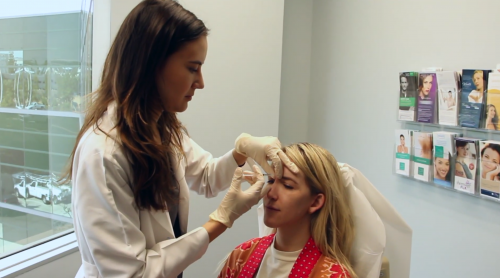 doctor injecting a female patient with botox, san diego, ca