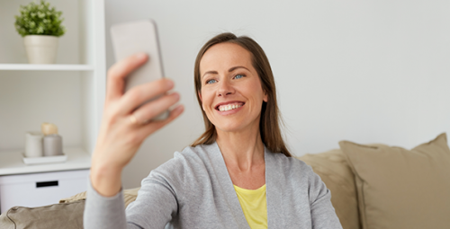 Woman Taking a Selfie with her Cellphone in San Diego, CA