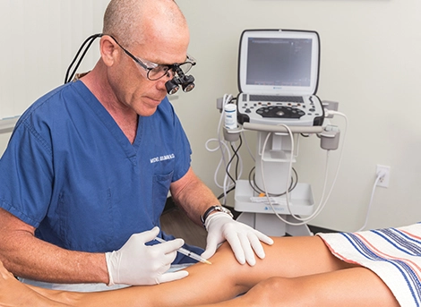 Dr. Mitchel Goldman performing a sclerotherapy treatment in San Diego, CA