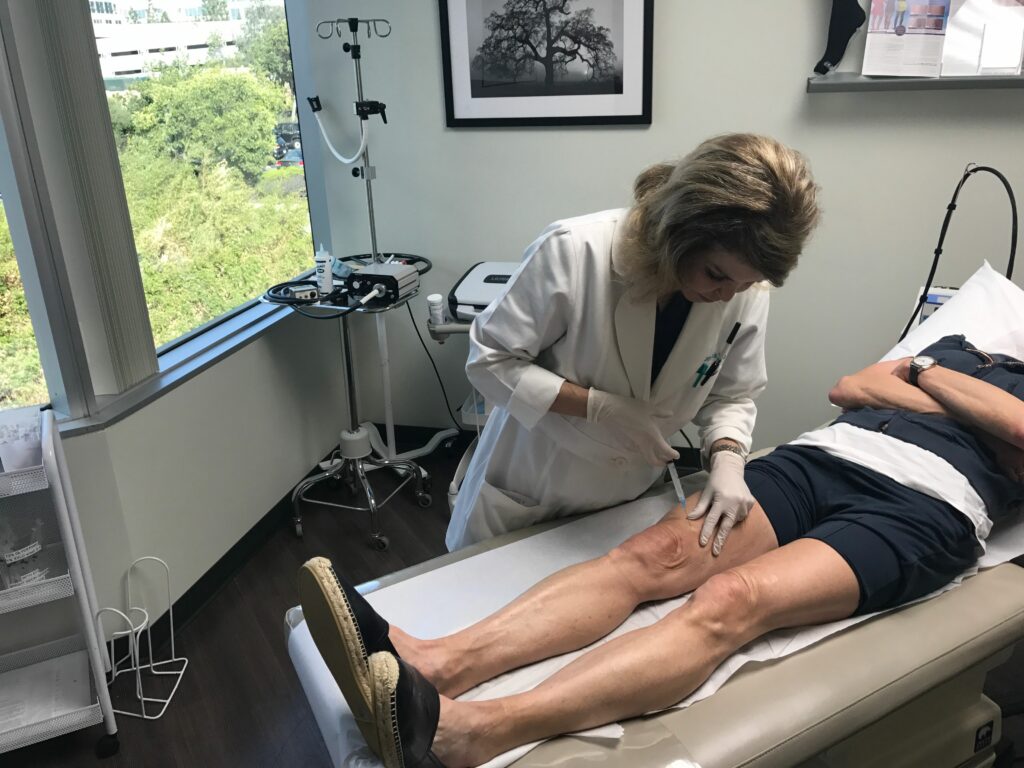 Dr. Butterwick performing a sclerotherapy treatment to treat spider and varicose veins in San Diego, CA