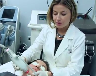 Dr. Fabi performing a laser skin rejuvenation treatment on a patient in San Diego