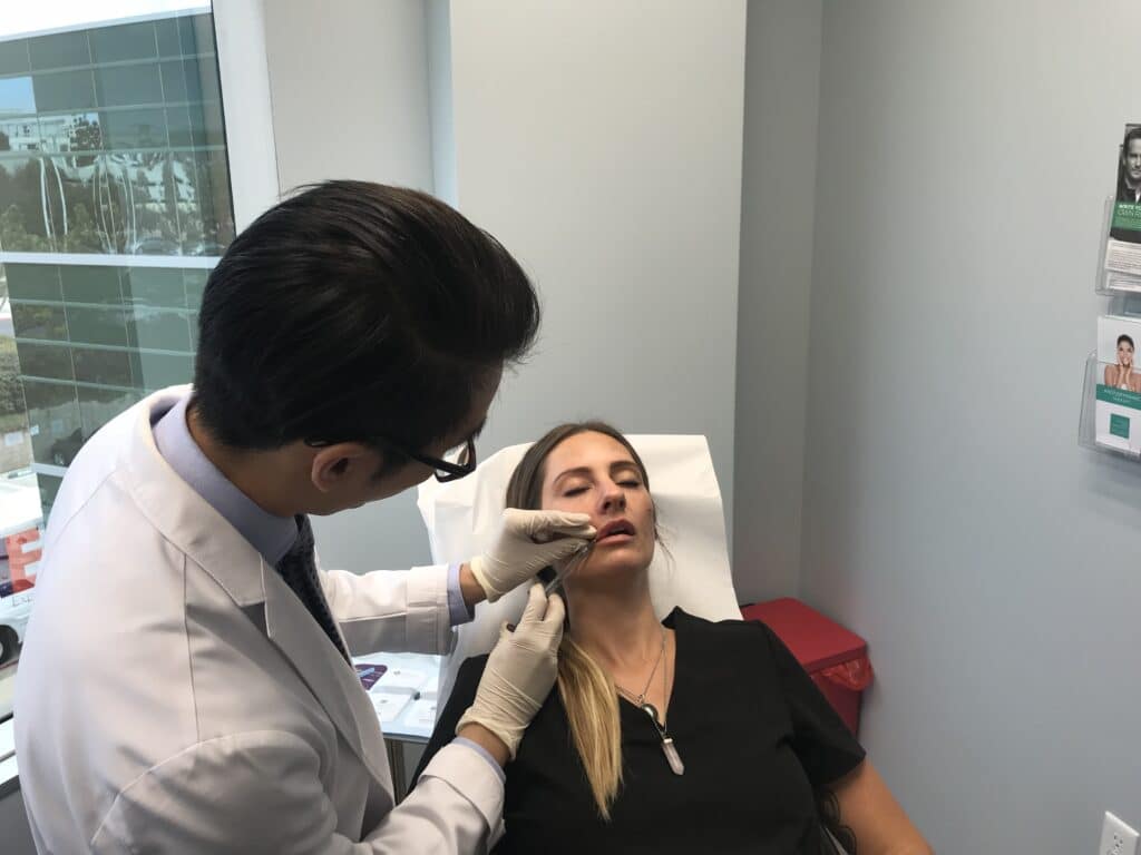 patient receiving lip filler treatment